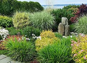A view toward the western bluff with a stone column water feature.