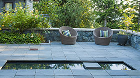 The reflecting pool in the Entry Courtyard defines one side of a conversation corner near the front door.