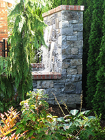 Water Feature by Vanessa Gardner Nagel - Side view of new stone and brick-trimmed water feature