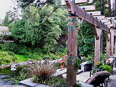 Back Terrace - Vanessa's design maximized view with new terrace, seating, and arbor that provides a great transition of scale from house to riverside